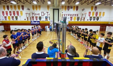 The gold and silver teams, left and right, line up for the OFSSA banner and medal presentations late Saturday afternoon.