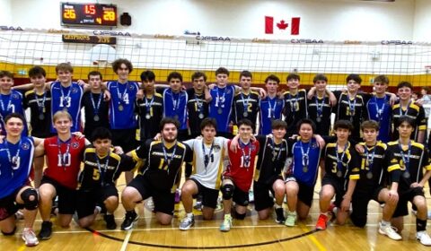 Good sports, the gold and silver team members pose for team photo.