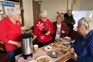 UCW women sell sweets in warming centre. UCW women sell sweets in warming centre.