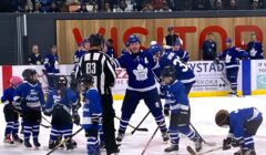 Gary Leeman wrangles Tim Bits for shinny game.