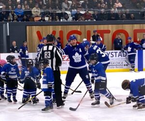 Gary Leeman wrangles Tim Bits for shinny game.