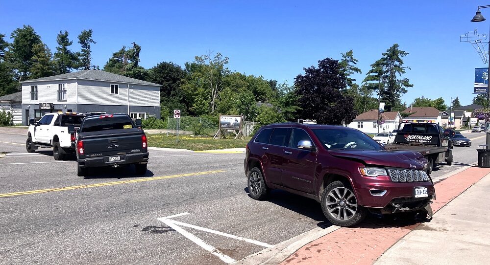 A tow truck leaves with the pickup just as a flatbed arrived to lift the Grand Cherokee. A tow truck leaves with the pickup just as a flatbed arrived to lift the Grand Cherokee.